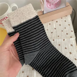 Comfortable striped mid-calf socks with contrast ribbed cuffs for women autumn winter.