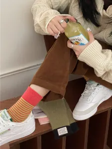 Stylish contrast color striped mid-calf socks for women, perfect for autumn winter casual daily wear.