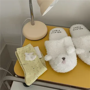 Fluffy animal plush slippers and yellow speckled mid socks set for cozy home casual wear.