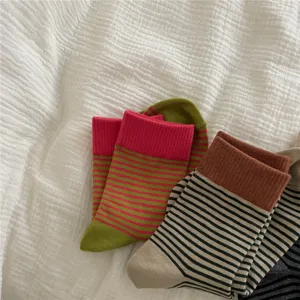 Cozy striped mid-tube socks for women, featuring stylish color-contrast ribbed cuffs for daily wear.