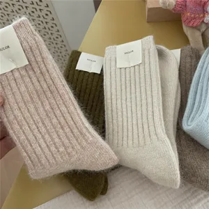 Cozy fuzzy ribbed winter socks detail view showing thick knit texture and warm fabric.