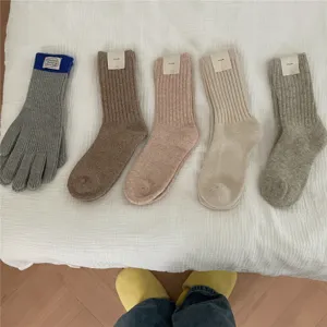 Cozy winter warm knitted wool socks and matching gloves set, thick comfortable daily wear.