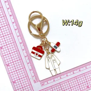 Cute medical theme metal keychain with doctor coat first aid kit charms 14g accessory