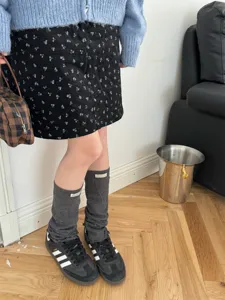 Grey Y2K knit leg warmers, stylish stacked sock covers for trendy streetwear outfits.