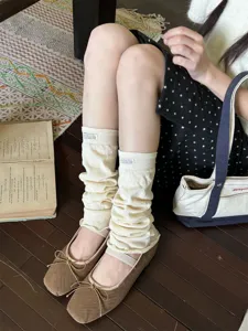 Cream knit leg warmers Y2K fashion style long calf socks cozy daily wear detail shot