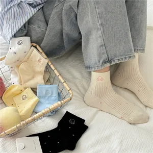 Cute polka dot ribbed short socks featuring sweet puppy embroidery for daily comfortable wear.