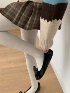Detail shot of women's speckled tights featuring a soft cotton texture and cozy fit.