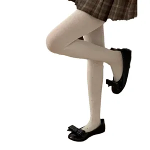 White fleece-lined dotted tights for women, winter cute cotton hosiery with bow flat shoes.