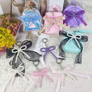 Handcrafted pearl bow keychain and lace bag charm, cute sweet aesthetic accessory for daily bags.