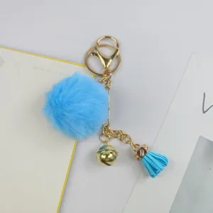 Blauer flauschiger Bommel Schlüsselanhänger mit Gold Beschlägen süßer Quasten Anhänger