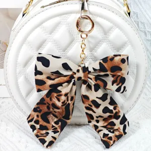 Porte-clés nœud imprimé léopard ruban tissu charm sac mignon pendentif clé de voiture chic