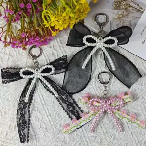 Handmade DIY pearl double bow keychain, cute lace and floral bag charm pendant accessory.