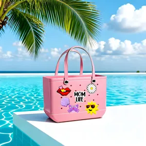 Pink EVA perforated beach bag featuring cute cartoon charms and MOM LIFE text for summer pool.
