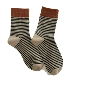 Cozy striped women mid-calf socks with contrast ribbed cuffs, classic casual daily wear.