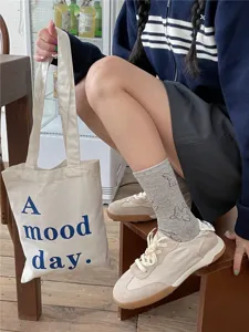 Cute dog print mid-tube socks for women, spring fashion casual cotton hosiery detail view.