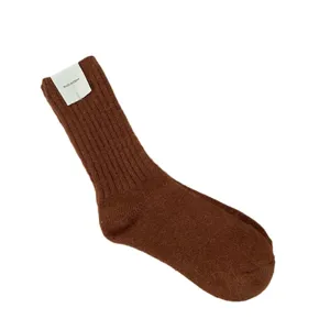 Brown fuzzy ribbed winter mid-calf socks for women, thick cozy warm knit casual hosiery.