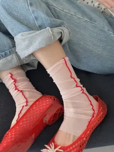 Sheer pink mesh calf socks with red lettuce trim, breathable summer style leg warmers for women.
