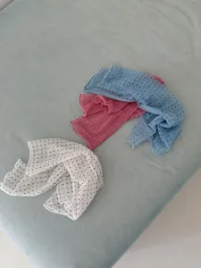 Sheer polka dot leg warmers detail, breathable mesh calf socks view showing white pink blue options.