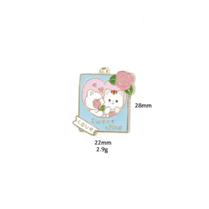 Close-up of enamel cat pendant detail, featuring love heart and rose design, metal charm.