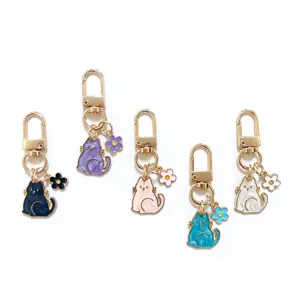 Cute cat keychain pearlescent enamel pendant mini flower bag ornament details close up