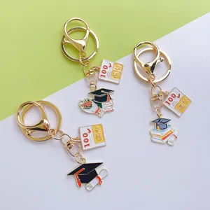 Graduation themed metal keychain set, cute graduation cap book charm student gift bag pendant.