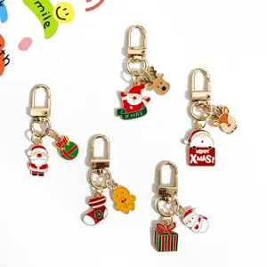 Cute Christmas metal keychains set, enamel Santa Claus and reindeer handbag charms.