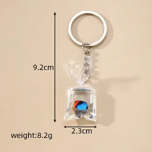 Cute resin tropical fish in water bag keychain, transparent creative keyring pendant for bags.