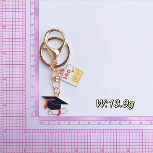 Graduation keychain with mortarboard and full marks charm metal accessory gift for students