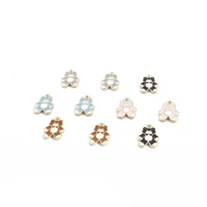 Close-up of cute enamel bear alloy charms pendants, assorted colors for DIY jewelry crafts.