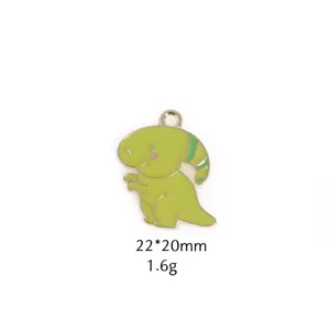 Green enamel dinosaur charm detail, cute cartoon animal zinc alloy pendant close-up view.