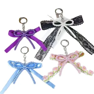 Handmade DIY imitation pearl bow keychain, sweet lace ribbon bag pendant accessory.