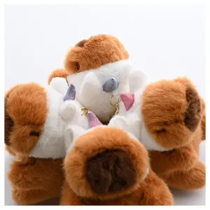 Detailed close-up of cute capybara plush keychain featuring a shiny glitter unicorn horn.