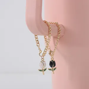 Detailed close-up of sweet enamel tulip charms on gold-plated chunky chains for cup decoration.