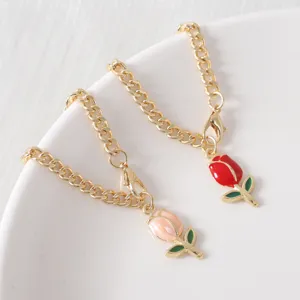 Detailed view of cute enamel tulip pendant charm with golden thick chain for Stanley cup.