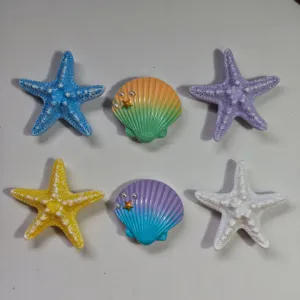 Detailed view of colorful resin seashell and starfish charms, perfect for bag decoration and DIY.