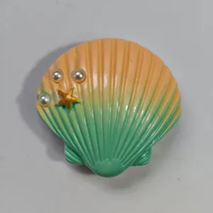 Seashell shaped hole bag charm detail, gradient color design with cute pearls and starfish.