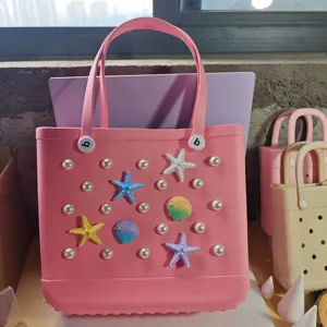 Pink rubber beach bag with pearl and seashell charms, durable hole tote bag for summer.