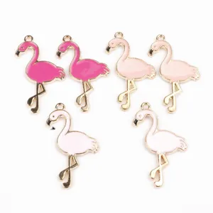 Close up of cute flamingo enamel alloy charms, perfect for DIY jewelry making and crafting.