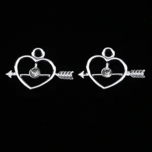 Silver heart arrow charm detail view showcasing crystal rhinestone inlay and metal alloy finish.