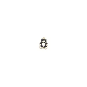 Close-up detail shot of a cute black and white enamel alloy bear pendant charm for DIY jewelry.