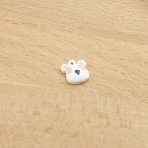 Close-up view of a cute animal head pendant, perfect for DIY bracelets and keychain making.