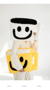 Plush smiley coffee mug pillow detail, soft fluffy material, cute living room decor.