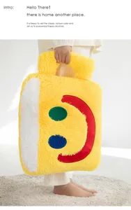 Plush yellow smiley face pillow bag detail view, soft fluffy texture with cute design, cozy home decor and cushion.