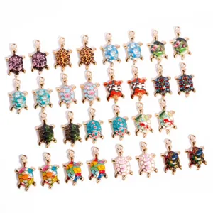 Detailed shot of colorful enamel turtle charms, zinc alloy metal pendants for DIY jewelry.
