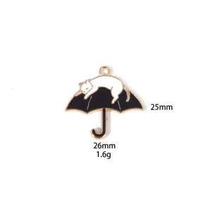 Black and white cat umbrella enamel pendant detail closeup, zinc alloy DIY jewelry accessory.