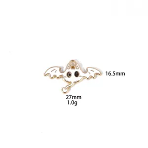 Close-up of cute devil cat enamel metal charm pendant with black and white details.