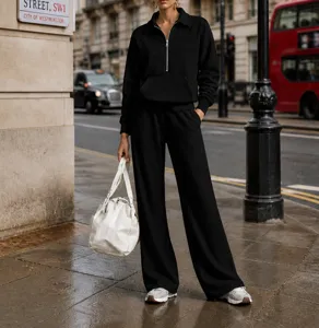Casual half-zip tracksuit set featuring a loose sweatshirt and wide-leg trousers for daily comfort.