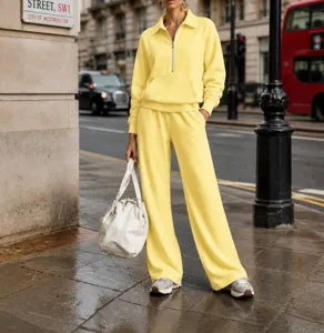 Casual yellow half-zip sweatshirt and loose sweatpants two-piece set, street style detail view