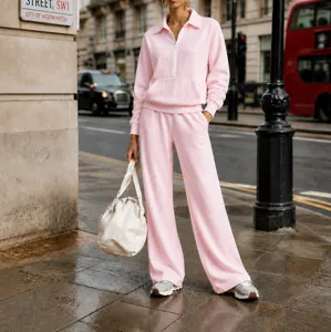 Pink zip-up sweatshirt and sweatpants set, casual two-piece sportswear outfit for women.