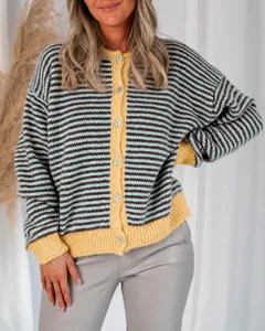 Close-up of casual striped knit cardigan featuring front button closure and cozy ribbed hem.